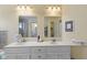 Bathroom with double sink vanity and large mirrors at 1114 Clairborne Ct, Indianapolis, IN 46280