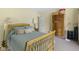 Bedroom with light wood frame bed, side table, and floor lamp at 1114 Clairborne Ct, Indianapolis, IN 46280