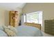 Bedroom featuring a large window, wardrobe, and a light wood frame bed at 1114 Clairborne Ct, Indianapolis, IN 46280