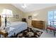 Bedroom with vaulted ceiling, ceiling fan, floral rug and light color scheme at 1114 Clairborne Ct, Indianapolis, IN 46280
