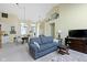 Bright and airy living room with dining area, showcasing the vaulted ceiling and modern furnishings at 1114 Clairborne Ct, Indianapolis, IN 46280