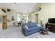 Open-concept living room with a vaulted ceiling, featuring a dining area and a view of the front door at 1114 Clairborne Ct, Indianapolis, IN 46280