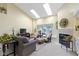 Cozy living room features a fireplace and skylights, filling the space with natural light at 1114 Clairborne Ct, Indianapolis, IN 46280
