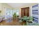 Bright sun room with slider doors to the deck and a vintage hutch at 1114 Clairborne Ct, Indianapolis, IN 46280