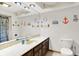 Bathroom with large mirror, vanity, and nautical decor at 13151 W Youth Camp Rd, Columbus, IN 47201