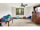 Bedroom with carpet floors, white walls, and a window overlooking a green backyard at 13151 W Youth Camp Rd, Columbus, IN 47201
