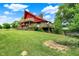 A multi-level home shows off its backyard and dual decks at 13151 W Youth Camp Rd, Columbus, IN 47201