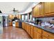 Large kitchen with wood cabinets, stainless steel appliances, and hardwood floors at 13151 W Youth Camp Rd, Columbus, IN 47201