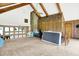 Loft area featuring vaulted ceilings, wood beams, and wood paneling on the walls at 13151 W Youth Camp Rd, Columbus, IN 47201