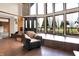 Spacious living room featuring tall windows and wood floors at 13151 W Youth Camp Rd, Columbus, IN 47201