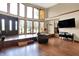 Spacious living room featuring tall windows and wood floors at 13151 W Youth Camp Rd, Columbus, IN 47201