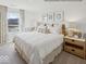 Serene primary bedroom suite with a neutral color palette, plush bedding, and decorative wall art creating a relaxing atmosphere at 1334 Aster Dr, Shelbyville, IN 46176