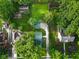 Aerial view of the property showing the green roof, a spacious backyard, and the surrounding residential neighborhood at 1420 E Loretta Dr, Indianapolis, IN 46227