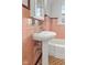 Bathroom featuring a pedestal sink with medicine cabinet, and colored tile at 1420 E Loretta Dr, Indianapolis, IN 46227
