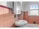 A full bathroom with sink, shower and retro tile at 1420 E Loretta Dr, Indianapolis, IN 46227