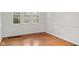 Sunny bedroom featuring hardwood floors and abundant natural light at 1420 E Loretta Dr, Indianapolis, IN 46227