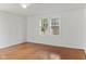 Spacious bedroom with hardwood floors and natural light from large windows at 1420 E Loretta Dr, Indianapolis, IN 46227