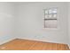 A cozy room with hardwood floors, white walls and window with a lattice at 1420 E Loretta Dr, Indianapolis, IN 46227