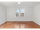 Bright bedroom with hardwood floors, white walls and trim, and natural light at 1420 E Loretta Dr, Indianapolis, IN 46227
