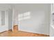 Bright bedroom featuring hardwood floors, white walls and access to additional rooms at 1420 E Loretta Dr, Indianapolis, IN 46227