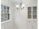 Bright dining room with unique stained-glass window and built-in china cabinet at 1420 E Loretta Dr, Indianapolis, IN 46227