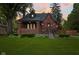 Charming brick home with a well-manicured lawn and inviting front porch at 1420 E Loretta Dr, Indianapolis, IN 46227