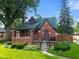 Charming brick home with a well-manicured lawn and inviting front porch at 1420 E Loretta Dr, Indianapolis, IN 46227