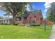 Charming brick home with a well-manicured lawn and inviting front porch at 1420 E Loretta Dr, Indianapolis, IN 46227