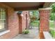 Inviting brick porch with seating area perfect for enjoying the outdoors at 1420 E Loretta Dr, Indianapolis, IN 46227
