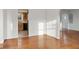Spacious living room with hardwood floors leading to an open kitchen at 1420 E Loretta Dr, Indianapolis, IN 46227