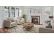 Bright living room with large windows, fireplace, and elegant furniture for relaxing and entertaining at 1420 E Loretta Dr, Indianapolis, IN 46227