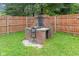 Exterior shot of a backyard brick grill with a built-in countertop space, perfect for outdoor cooking and entertaining at 1420 E Loretta Dr, Indianapolis, IN 46227