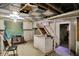 Unfinished basement with stairs, concrete floors, and partial cabinets ready to be remodeled at 2029 N Colorado Ave, Indianapolis, IN 46218