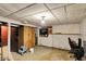 The basement features a drop tile ceiling, concrete floors, and a brick accent wall at 2029 N Colorado Ave, Indianapolis, IN 46218