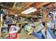 This cluttered garage has a workbench and plenty of space for storage at 2029 N Colorado Ave, Indianapolis, IN 46218