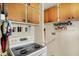 Kitchen showing wooden cabinets and spices on shelves near the electric stovetop at 2029 N Colorado Ave, Indianapolis, IN 46218