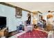 Living room featuring comfortable seating, storage space, and television at 2029 N Colorado Ave, Indianapolis, IN 46218