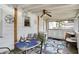 Enclosed patio features white siding, windows, indoor/outdoor carpet and a dining area at 2029 N Colorado Ave, Indianapolis, IN 46218