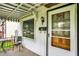 Close up of a front porch featuring outdoor seating and charming details at 2029 N Colorado Ave, Indianapolis, IN 46218