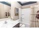 Clean bathroom featuring a shower and tub combo with modern fixtures, complemented by a stylish vanity and neutral color scheme at 2057 Abbey Ln, Columbus, IN 47201