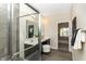 Bathroom featuring tiled shower, and double vanity at 2057 Abbey Ln, Columbus, IN 47201