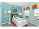 Bright, inviting bedroom with playful dinosaur theme, featuring colorful decor, themed bedding, and ample natural light at 2057 Abbey Ln, Columbus, IN 47201