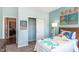 bedroom with a dinosaur theme featuring a comfortable bed, playful decor, and an accessible closet at 2057 Abbey Ln, Columbus, IN 47201