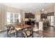 Bright kitchen and dining area with modern appliances and a large window for natural light at 2057 Abbey Ln, Columbus, IN 47201