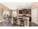 Modern kitchen with a central island and breakfast bar that connects to a dining area with large windows at 2057 Abbey Ln, Columbus, IN 47201