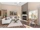 Open-concept living room features fireplace, lots of seating, and high ceilings at 2057 Abbey Ln, Columbus, IN 47201
