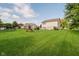 Lush backyard with trampoline and play set providing a great space to play outdoors at 20846 Winding Lake E Dr, Noblesville, IN 46062