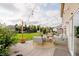 Inviting backyard with patio furniture, string lights, and lush landscaping at 20846 Winding Lake E Dr, Noblesville, IN 46062