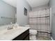 Cozy gray bathroom featuring a shower/tub combo with neutral-toned striped curtain at 20846 Winding Lake E Dr, Noblesville, IN 46062