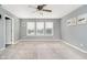 Bright bedroom featuring large windows, neutral carpet, and fresh paint for a cozy atmosphere at 20846 Winding Lake E Dr, Noblesville, IN 46062